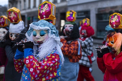 Basel, switzerland - march 11th, 19. one illuminated carnival lantern sticking out from the crowd.