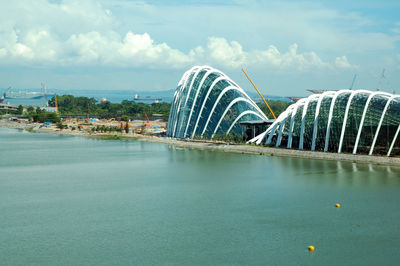 Panoramic view of modern building against cloudy sky