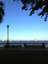 Distant view of harbor against clear blue sky