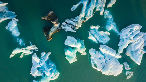 Aerial view of icebergs in sea during winter