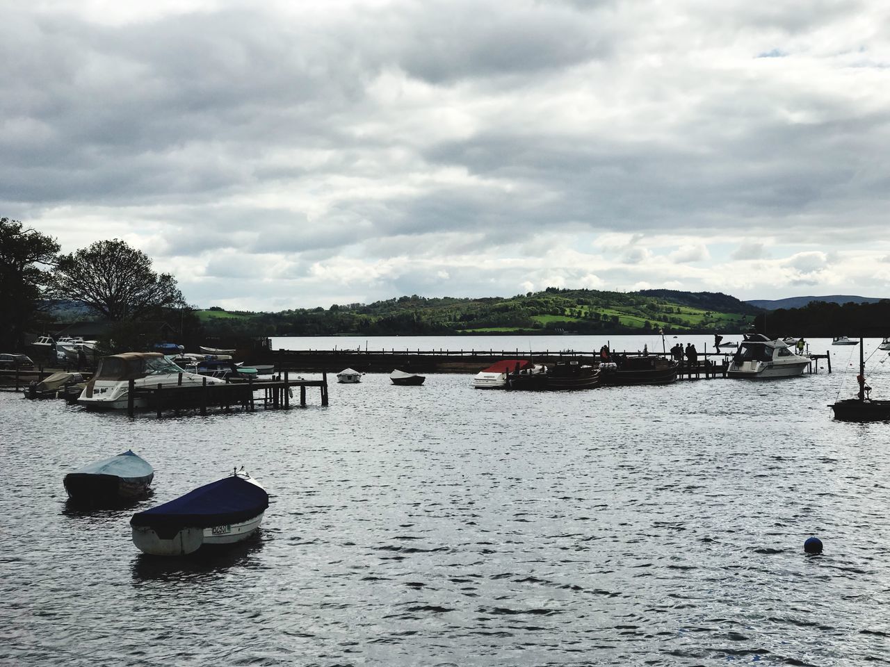 BOATS IN RIVER AGAINST SKY