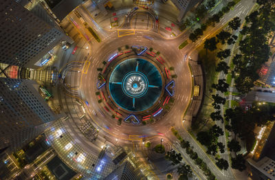 High angle view of city lit up at night