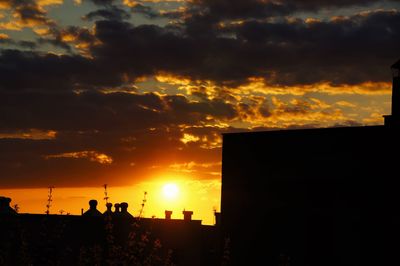 Scenic view of dramatic sky at sunset