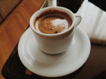 High angle view of coffee cup on table