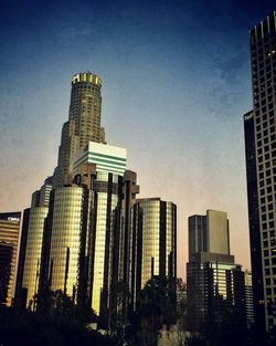 Low angle view of modern buildings against sky