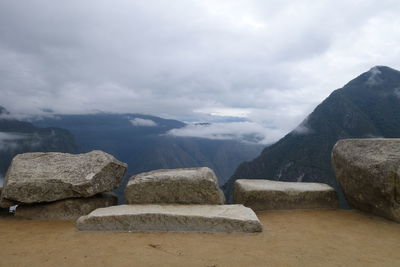 Scenic view of rocks in mountains against sky