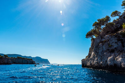 Scenic view of sea against blue sky