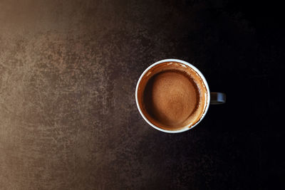 Directly above shot of coffee cup on table