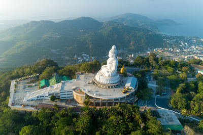 High angle view of statue on mountain against sky