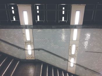 Illuminated railroad station platform at night