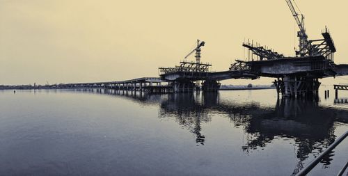 Pier by sea against sky