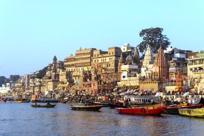 View of buildings in city against clear sky