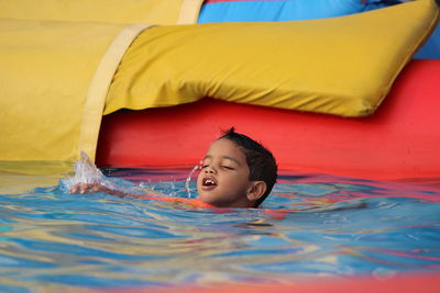 Cute boy in swimming pool