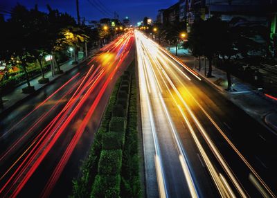 High angle view of light trails on road at night