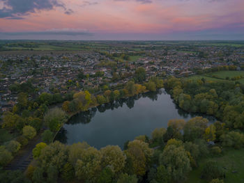 An aerial view of the lake at sunrise in needham market, suffolk uk