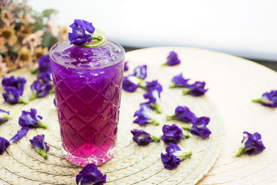 Close-up of purple flower on table