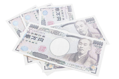 High angle view of coins on white background