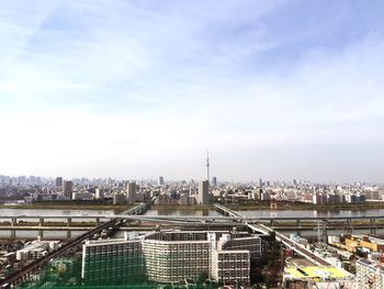 Cityscape against cloudy sky