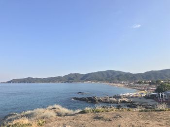 Scenic view of sea against blue sky