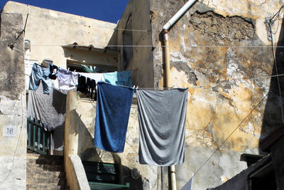 Clothes drying on wall of building