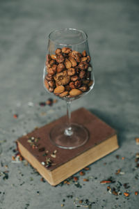 Close-up of almonds in glass on table