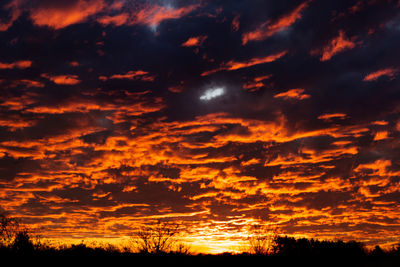 Scenic view of dramatic sky during sunset