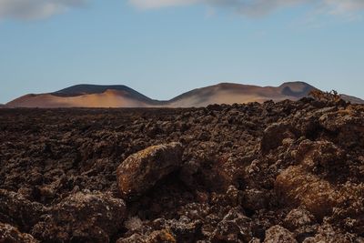 Panoramic view of volcanic landscape against sky