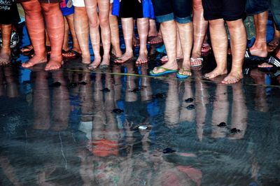 Low section of people standing in water