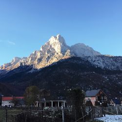 Low angle view of mountain against clear blue sky