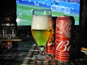 Close-up of beer glass on table