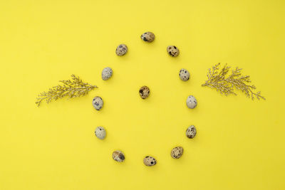 High angle view of birthday cake against yellow background