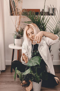 Woman sitting on chair at home