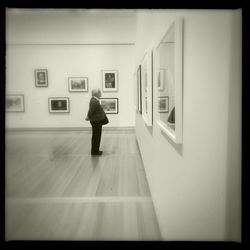 Full length of woman standing on wall