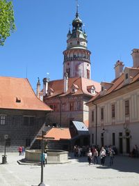 People in city against clear sky