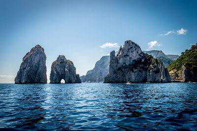 Panoramic view of sea and mountains against sky