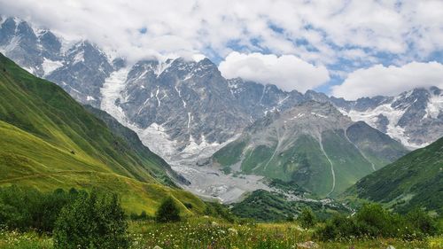 Scenic view of snowcapped mountains against sky