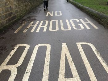 High angle view of road sign on street