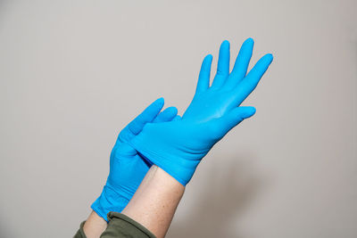 Close-up of human hand over white background