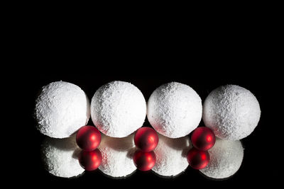 Close-up of balloons against black background