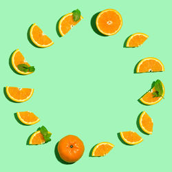 High angle view of oranges against white background