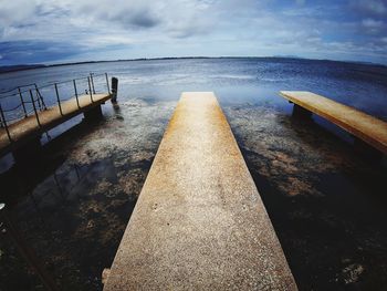 Pier over sea against sky