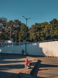 Rear view of people walking on street