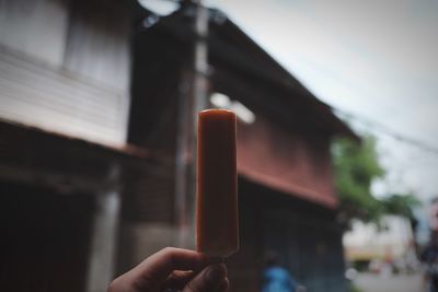 Cropped hand of woman holding ice cream