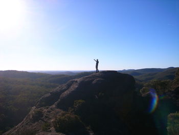 Scenic view of landscape against blue sky