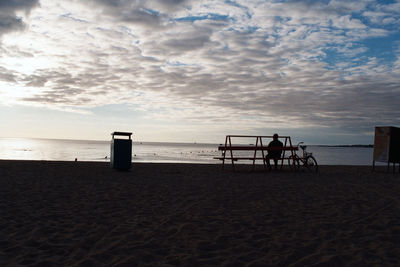 Scenic view of beach against sky during sunset