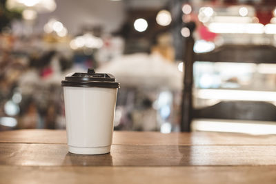 Close-up of coffee served on table at cafe