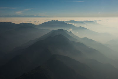 Scenic view of mountains against sky during sunset