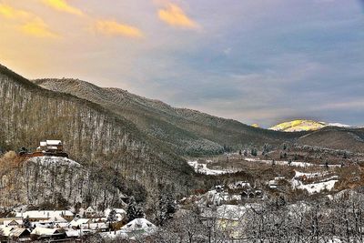 Scenic view of mountains against sky during winter