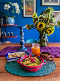 Close-up of fresh fruits in vase on table