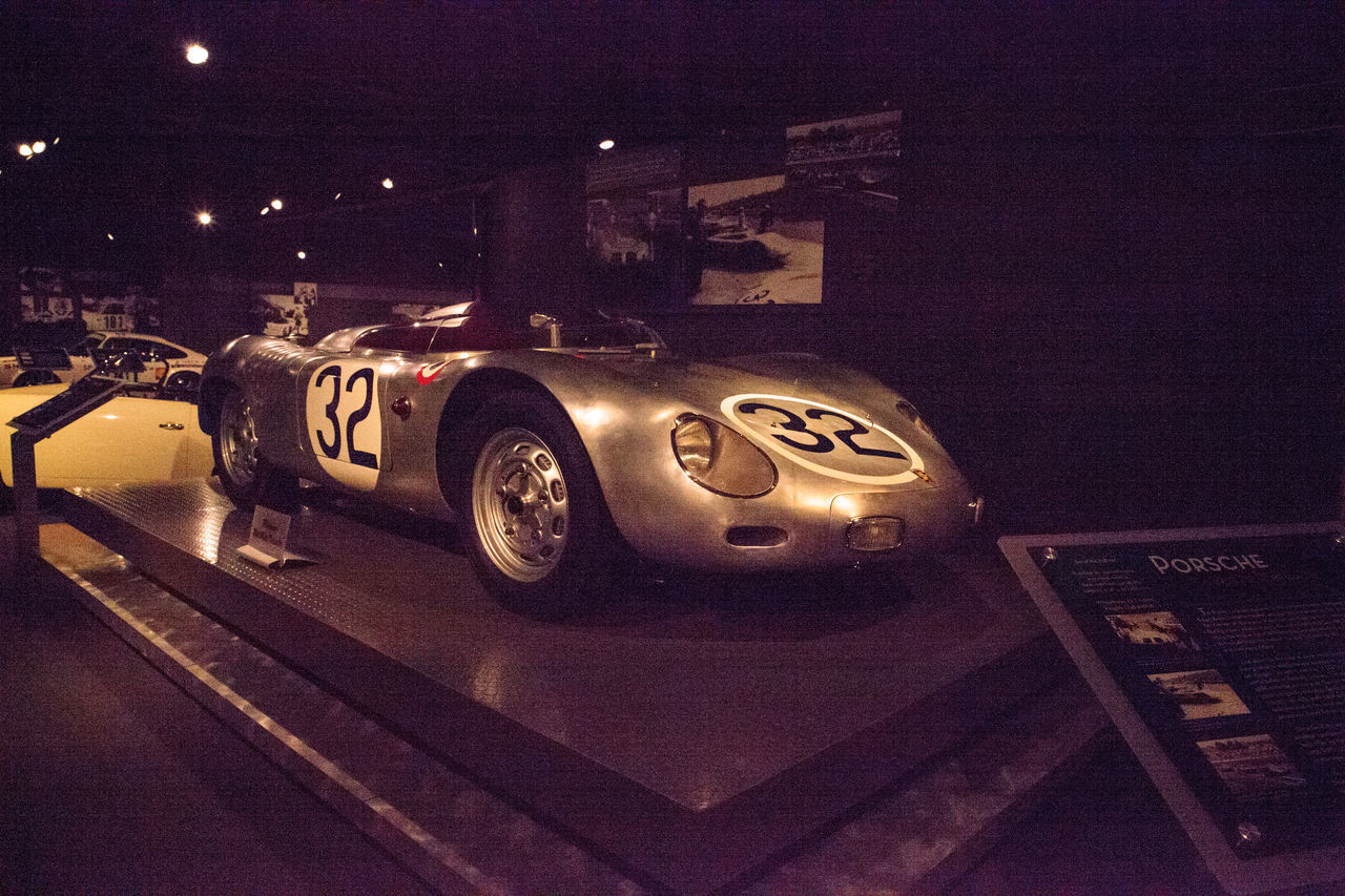 CLOSE-UP OF TOY CAR ON TABLE AT NIGHT